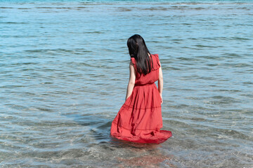 Woman in Red Dress by the Sea①