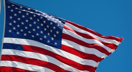 Obraz premium American flag waving in a blue sky