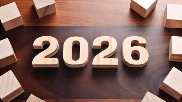 "2026" Wooden Number Blocks on Wooden Table with Scattered Cubes