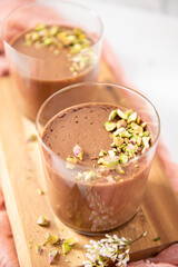 Two elegant glasses of smooth chocolate dessert