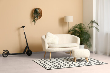 Electric scooter near white sofa in living room