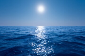 Obraz premium Deep blue ocean waves reflecting bright sun path across a vast, endless horizon under a clear azure sky, peaceful view, concept for marine related publications, tranquil scene presentations