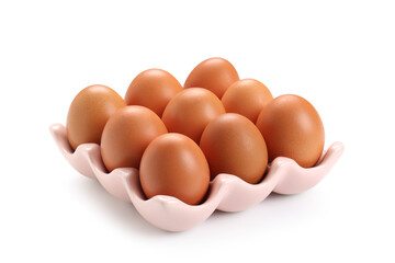 Ceramic holder with brown chicken eggs on white background