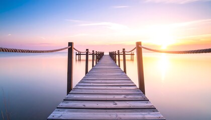 Fototapeta premium Serene wooden pier at sunset over calm water