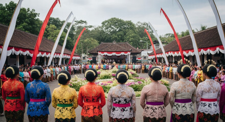 A group of women in colorful traditional Kebaya dresses stand in a circle during a cultural celebration in Indonesia independence day August, surrounded by flags and decorations.