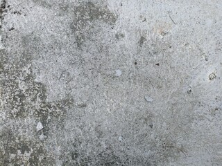 Rough Weathered Concrete Surface with Dirt. Close-up of dirty and rough concrete texture with natural stains and specks. Ideal for background, grunge effect, or construction concept