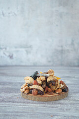 Dried fruits and nuts arranged on a wooden board