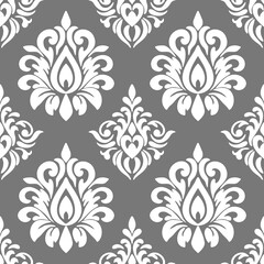 Wallpaper in the style of Baroque. Seamless vector background. White and grey floral ornament. Graphic pattern for fabric, wallpaper, packaging. Ornate Damask flower ornament.