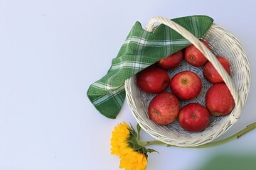 Red apples in a basket, free space, top view