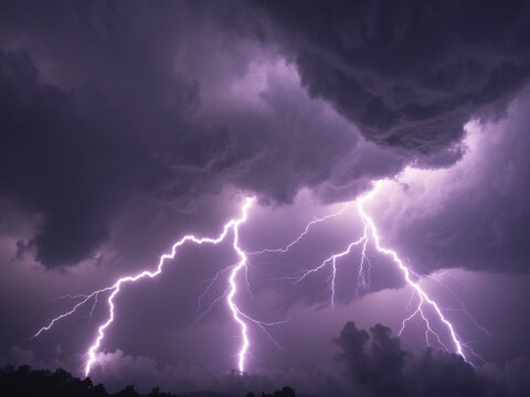 Dramatic night sky with intense purple lightning striking through dark, heavy storm clouds.