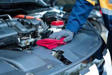 Asian male automotive technician who inspects, repairs, and maintains all vehicle systems,ensuring...