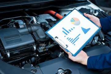 Asian male automotive technician who inspects, repairs, and maintains all vehicle systems,ensuring...