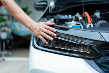 Asian male automotive technician who inspects, repairs, and maintains all vehicle systems,ensuring safe and optimal performance through expertise in engines, brakes, transmissions electrical systems