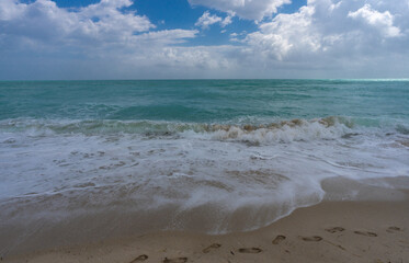 Sea wave. Blue ocean waves. Foamy wave. Rolling sea beach waves. Gentle sea beach wave. Summer sea beach.