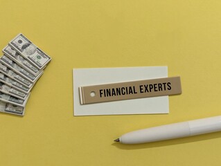 miniature banknotes and pen. Financial Experts words. business finance 