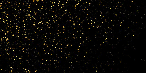 Gold glitter texture on a black background. Holiday background. Golden explosion of confetti. Golden grainy abstract texture on a black background. Design element