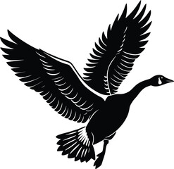 Obraz premium Black silhouette of a goose in flight with wings spread wide bird flying