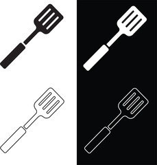 A sleek black spatula with ventilation slots and a hanging hole on a white backdrop Black silhouette of a kitchen spatula