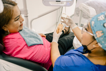 Dental professional demonstrating oral hygiene techniques