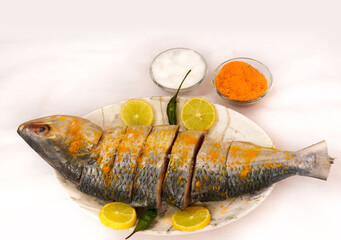 Indian fish fry recipe- fresh whole Hilsa fish or Ilish fish or Poplet cut into slices. cleaned and...