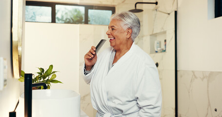Senior woman, singing and brush in bathroom with music, getting ready and karaoke concert. Elderly...