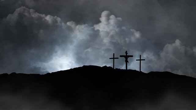 jesus cross silhouette on top of mountain