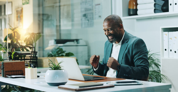 Fist pump, laptop and black man in office with winning, bonus or job promotion email with celebration. Happy, finance business and African male financial manager with investment approval in workplace