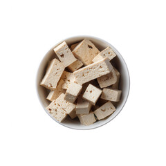 Fototapeta premium Delicious pieces of nougat nestled in a round bowl, ideal for sweet treat lovers and dessert enthusiasts.