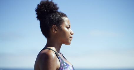 Black woman, fitness and thinking at beach, sky or breathing with mockup space on break. African...
