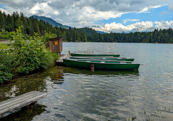 Rowing boats on the banks of the Hintersee, a picturesque mountain lake in the Berchtesgaden...