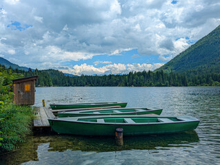 Rowing boats on the banks of the Hintersee, a picturesque mountain lake in the Berchtesgaden...