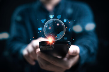 A person holds a smartphone with digital icons representing global connectivity and e-commerce...