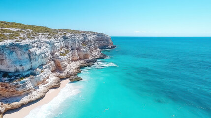 Stunning coastline with turquoise waters and rocky cliffs under clear blue sky