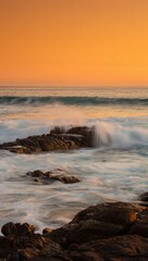 Obraz premium Dramatic Hawaiian Sunset with Crashing Waves on Rocky Coastline 