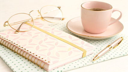 Desk Still Life with Coffee, Glasses, and Notebook, a Study in Delicate Pinks and Soft Gold Accents