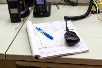 Communication Desk with Radios and Logbook