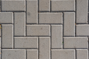 Background of a sidewalk paved with concrete block paving