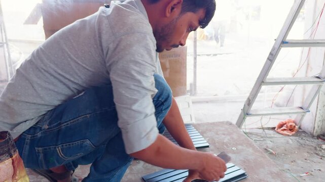 Renovation Worker Shapes Panel sitting in Shop