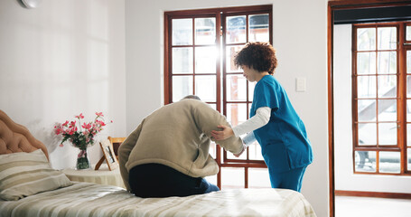 Senior man, caregiver or helping patient on bed for assisted living or support in retirement home....