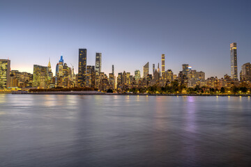 The skyline of Midtown Manhattan with the Chrysler Buidling after sunset
