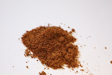 Scattered piles of brown sugar