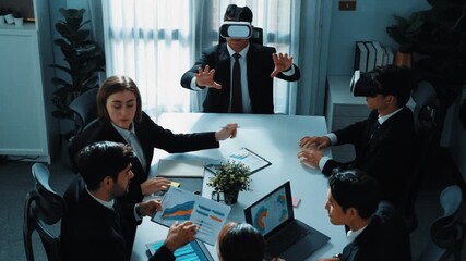 Top view of manager working on laptop and sending data analysis to business people by using VR glass headset while diverse team planning marketing strategy and looking at financial graph. Directorate. - Powered by Adobe