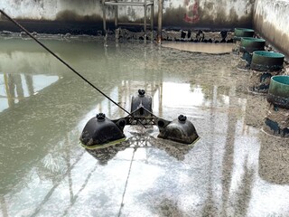Oil separation tank with floating equipment for industrial wastewater treatment. Surface covered...