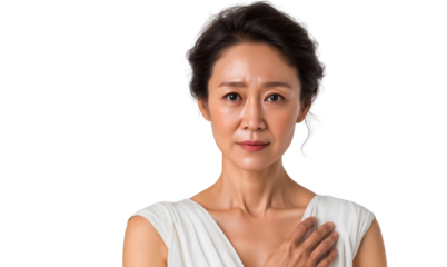 Senior Asian woman with hand on chest, expressing worry or thoughtfulness