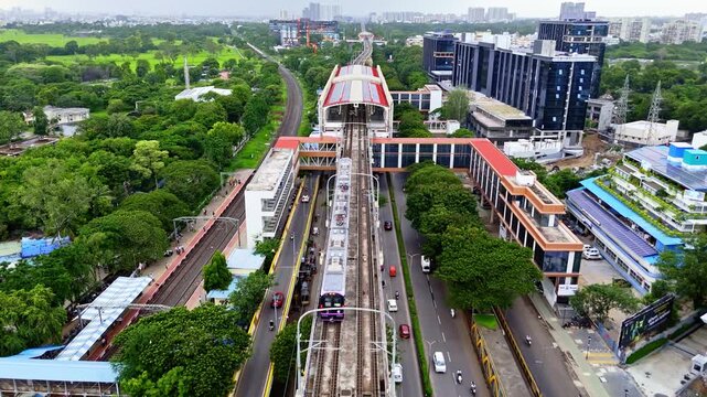 Drone Shot Metro Train running near elevated bridge