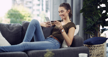 Happy woman, phone or sofa with credit card for ecommerce, online payment or purchase in home. Female person, shopper or user with smile on mobile smartphone for remote shopping app or order in house