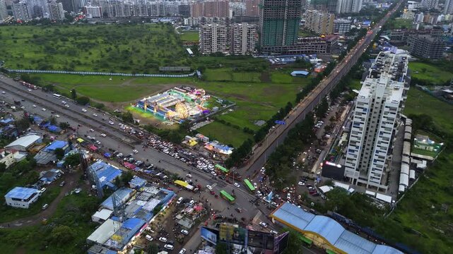 Drone capture city crossroad packed by steady traffic