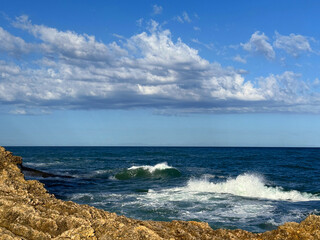 Sea storm waves and rocky coastline 