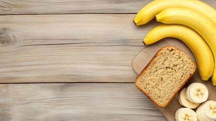 Banana bread and bananas on wooden table