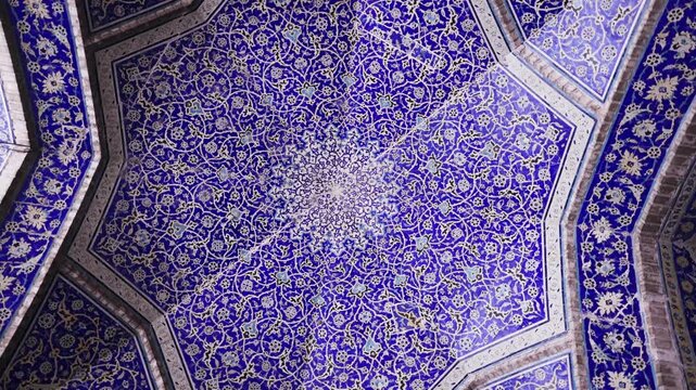Ceiling at Imam Mosque, arch at the entrance, Naghsh-e Jahan Square, Isfahan, Iran. Beautiful oldest iranian mosque interior design. Unique mosaics and ornaments. A masterpiece of Persian architecture